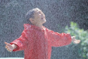 Boy Playing in Rain